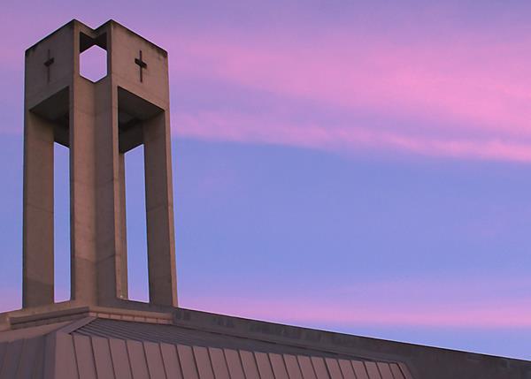 Image of the church steeple at sunset.